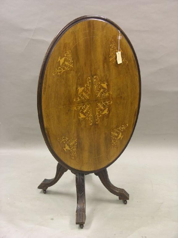 Appraisal: A small Victorian walnut loo table oval quarter-veneered top inlaid