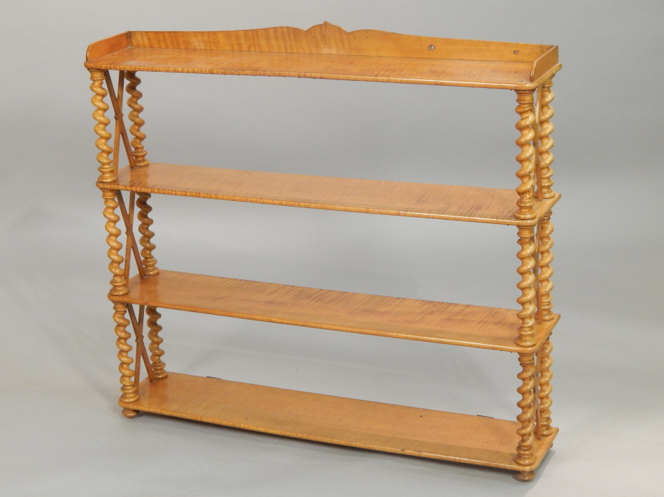 Appraisal: A Victorian satin birch wall shelf with a raised gallery