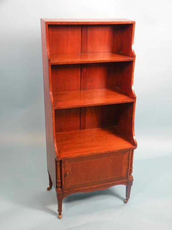 Appraisal: A mahogany and tulipwood cross banded waterfall bookcase with one