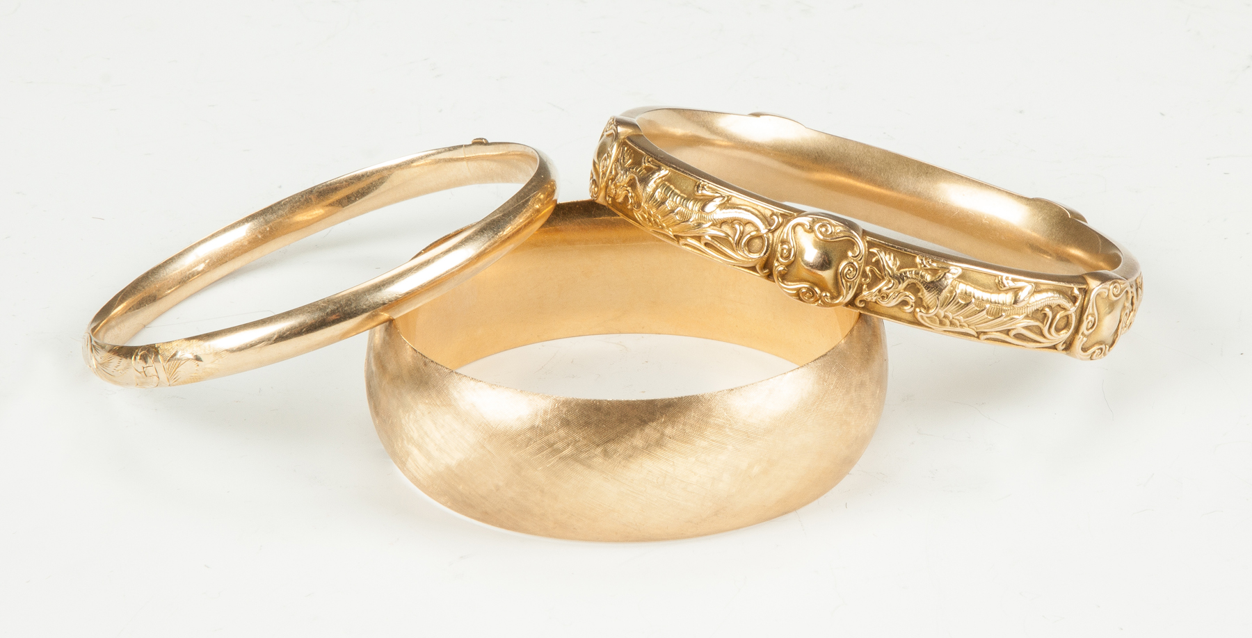 Appraisal: Three Gold Bangle Bracelets Two K one K Total dwt