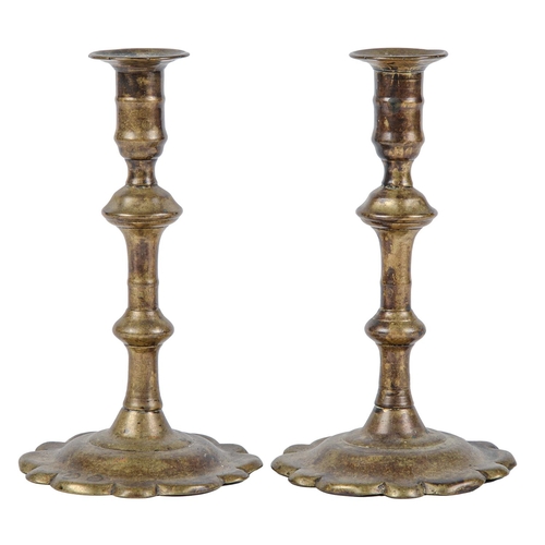 Appraisal: A pair of English brass candlesticks th c with mushroom