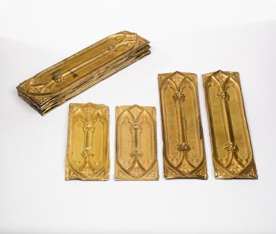 Appraisal: Eight Victorian Gothic brass door plates with arched mullions cm