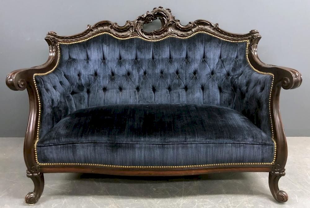 Appraisal: Ornate Victorian Mahogany and Blue Velvet Settee Ornate Victorian mahogany