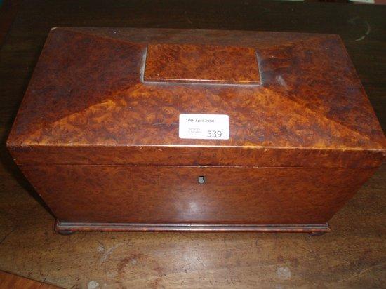 Appraisal: A Regency burr yew sarcophagus shaped tea caddy with two