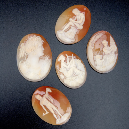 Appraisal: Five unmounted carved shell cameos with classical images signed Largest