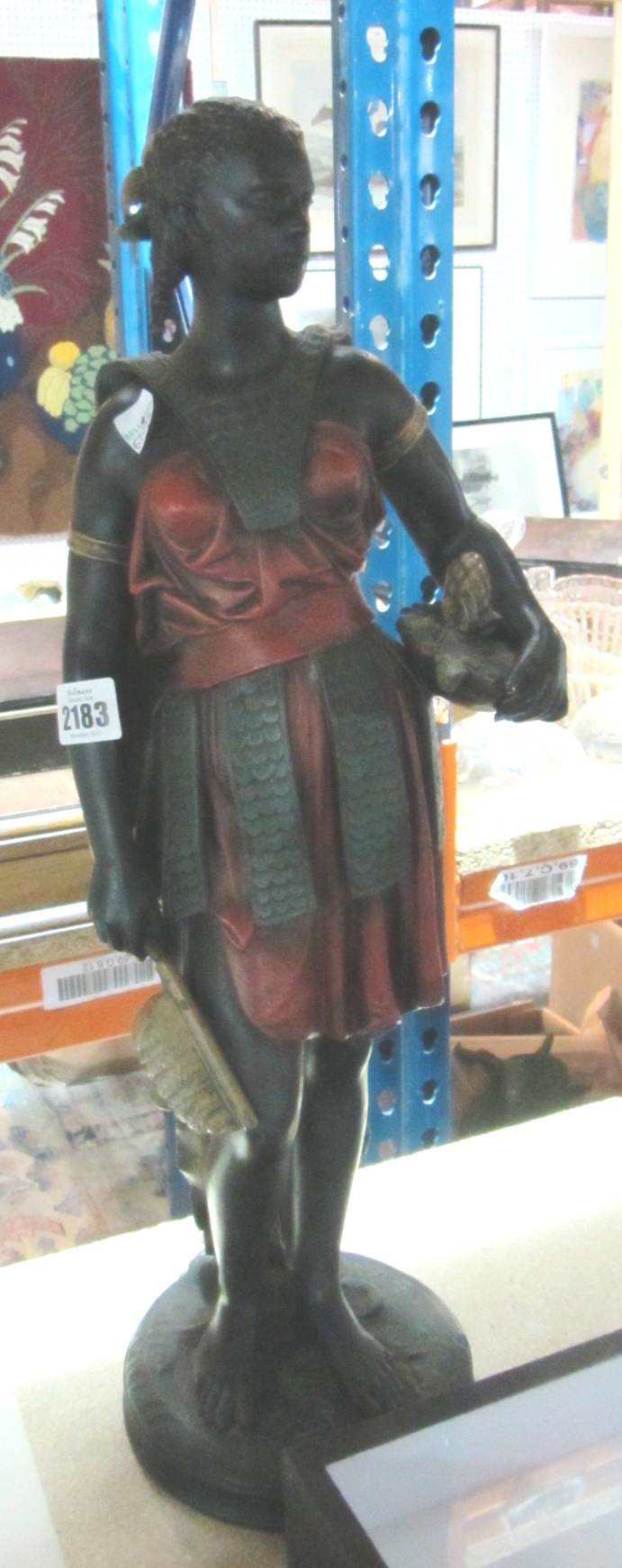 Appraisal: A painted metal figure of a nubian female