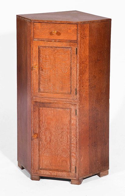 Appraisal: Heals oak corner cupboardcirca with two cupboard sections below a