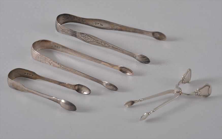 Appraisal: THREE PAIRS OF SILVER TONGS AND A GEORG JENSEN PAIR