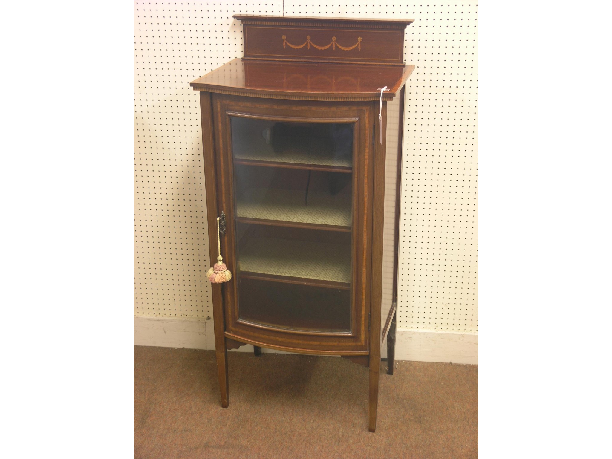 Appraisal: An Edwardian inlaid mahogany display cabinet bow-fronted with single glazed