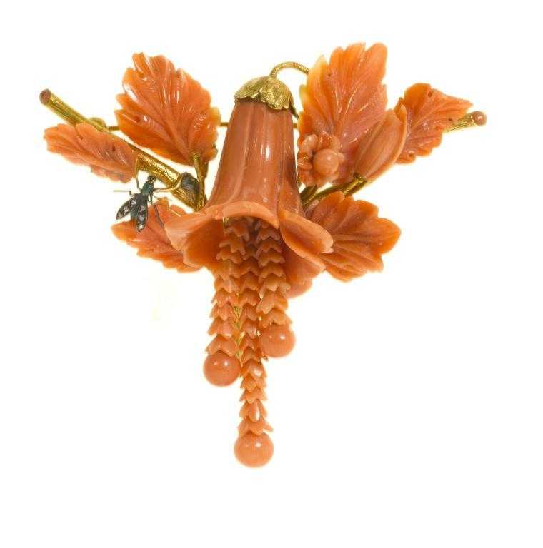 Appraisal: AN ANTIQUE CORAL AND GOLD BROOCH carved as a bell