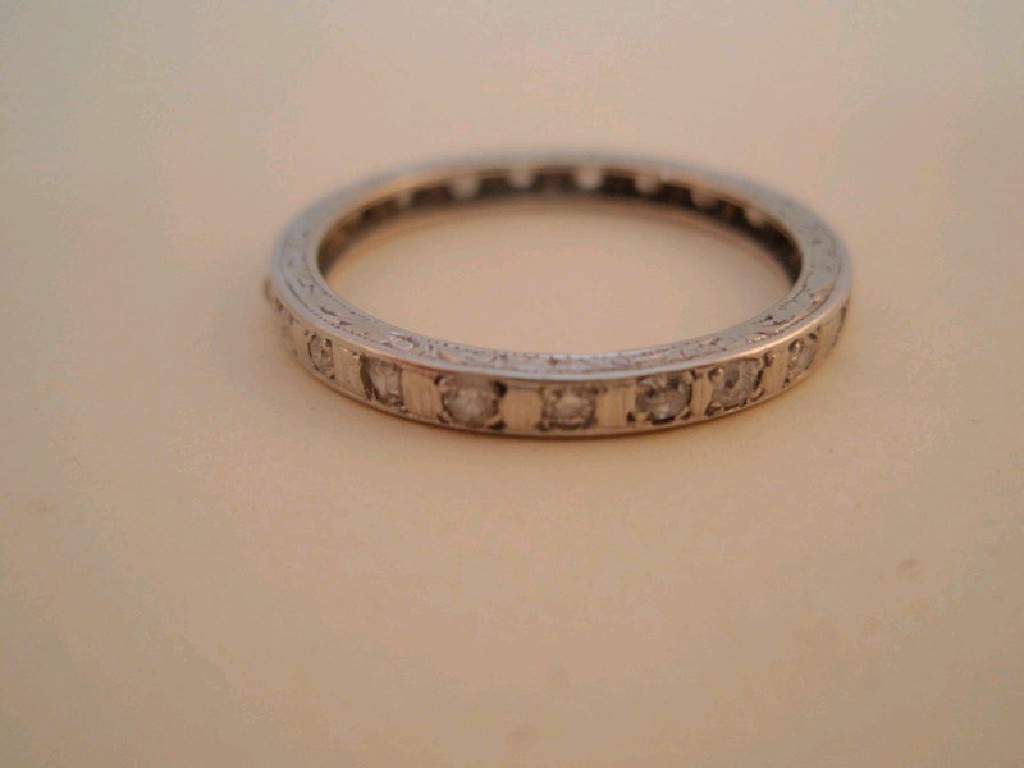 Appraisal: A full hoop eternity ring in white metal set with