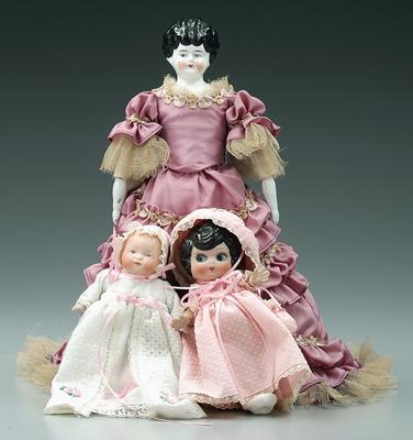 Appraisal: Three dolls Victorian with porcelain head arms and legs painted