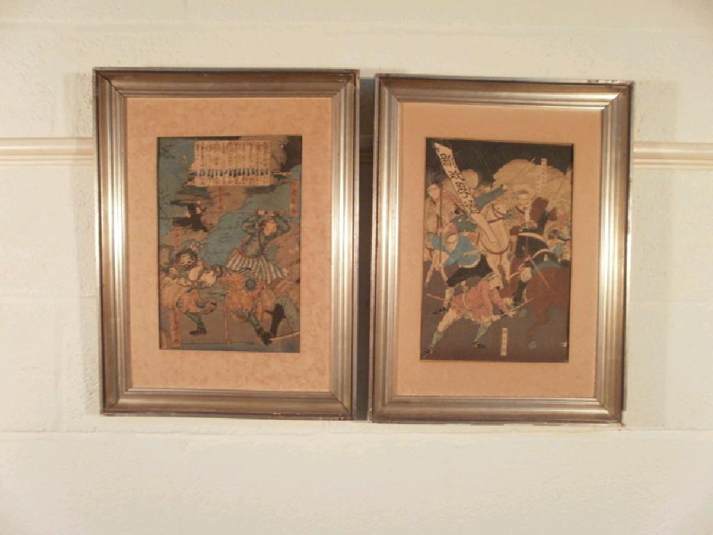 Appraisal: A pair of Japanese colour prints of fighting scenes signed