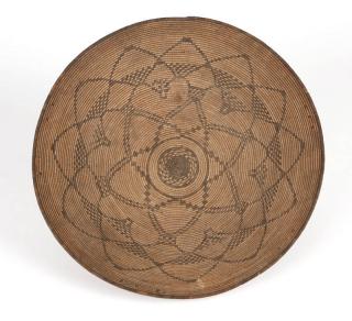 Appraisal: An Apache coiled basketry tray First quarter th century woven