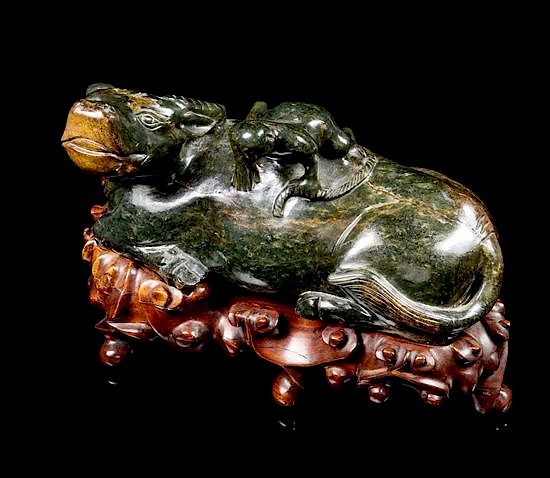 Appraisal: A Spinach Jade Figural Group of a Ox and a