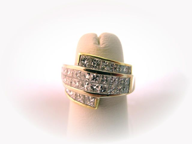 Appraisal: K yellow gold diamond ring contemporary design set with invisible