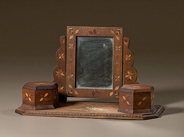 Appraisal: FOLKY INLAID WALNUT DRESSER MIRROR WITH CADDIES American ca inlaid