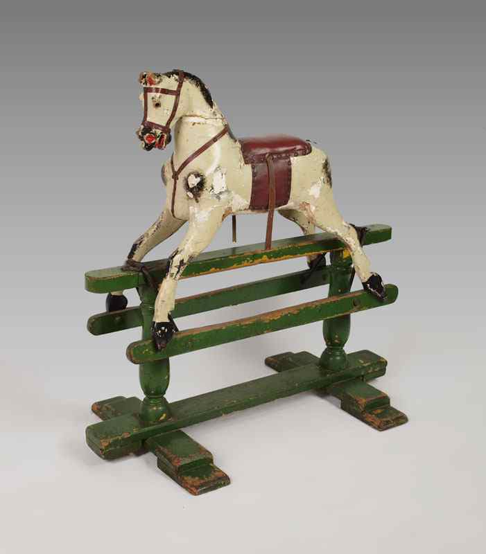 Appraisal: VINTAGE ENGLISH CHILDS RIDING HORSE Wood construction with metal hardware