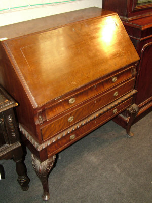 Appraisal: A mahogany bureau on stand th century the fall front