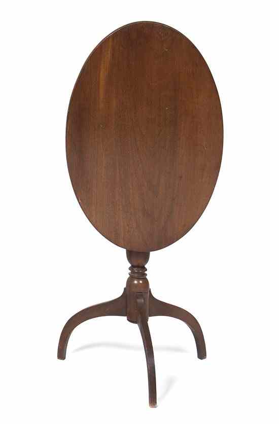 Appraisal: A Mahogany Tilt-Top Occasional Table having an oval top raised