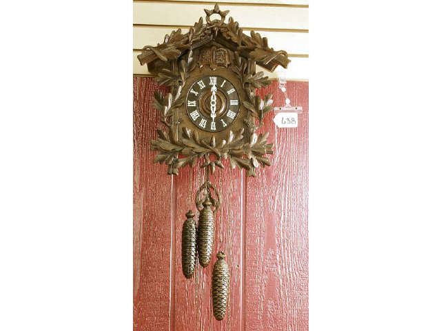 Appraisal: Nicely carved Black Forest wall cuckoo clock features three weights