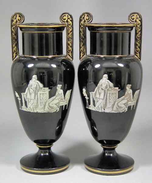 Appraisal: A pair of Victorian black glass two handled urns of