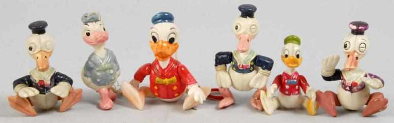 Appraisal: Lot of Celluloid Disney Donald Duck Figures Description Japanese Four