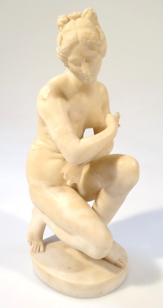 Appraisal: A thC marble effect figure of Venus in crouched position