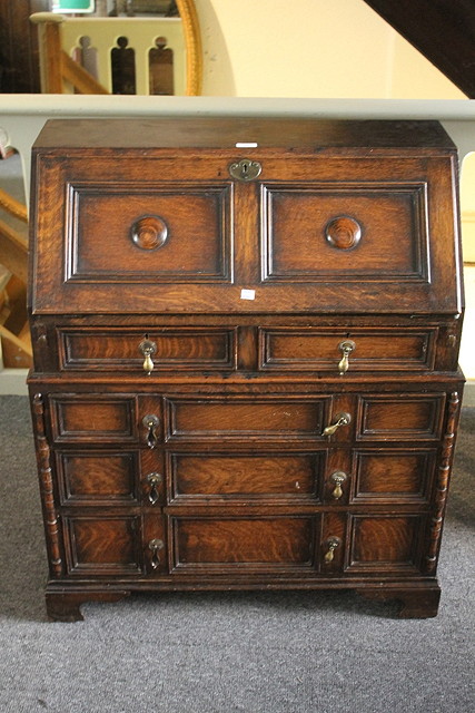 Appraisal: AN OAK CAROLEAN STYLE BUREAU with fall front fitted two