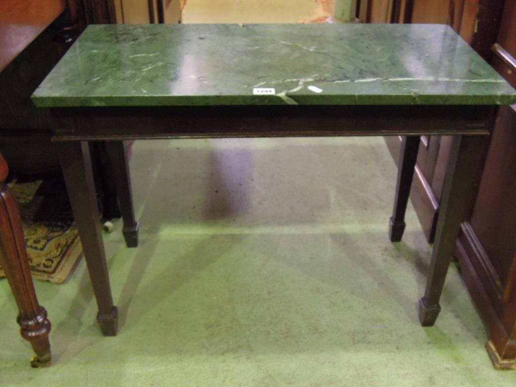 Appraisal: A mahogany occasional table of rectangular form with green flecked