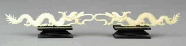 Appraisal: Parr of Chinese Carved Ivory Dragons on StandsMatching pair of