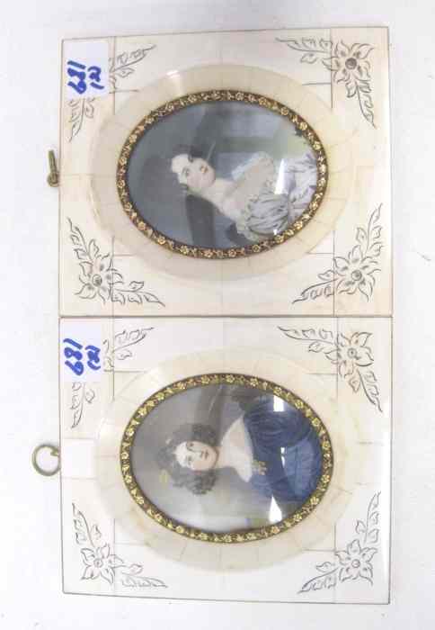 Appraisal: PAIR OVAL PORTRAIT MINIATURES depicting beautiful women in matching ivory