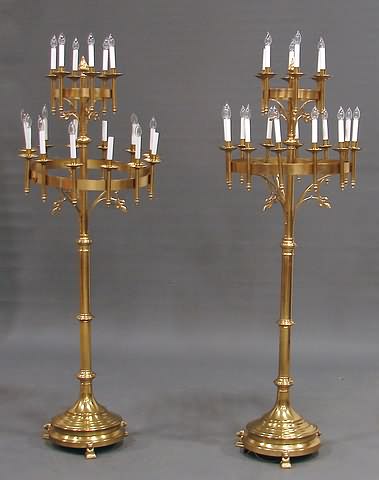 Appraisal: Electrified circular tiers with lights and brass flaming finial larger