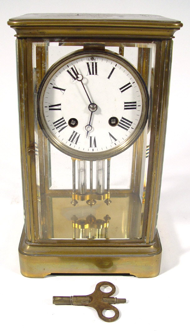 Appraisal: Brass cased chiming mantel clock with bevelled glass panels and