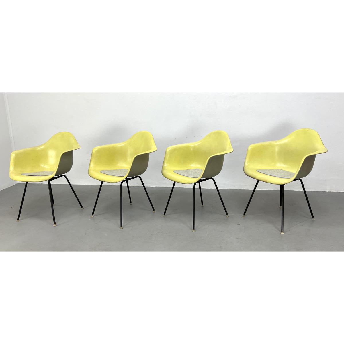 Appraisal: Set CHARLES EAMES Fiberglass Shell Lounge Chairs Yellow Fiberglass forms