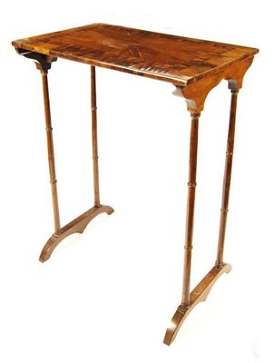 Appraisal: An Irish yew wood occasional table the crossbanded rectangular top