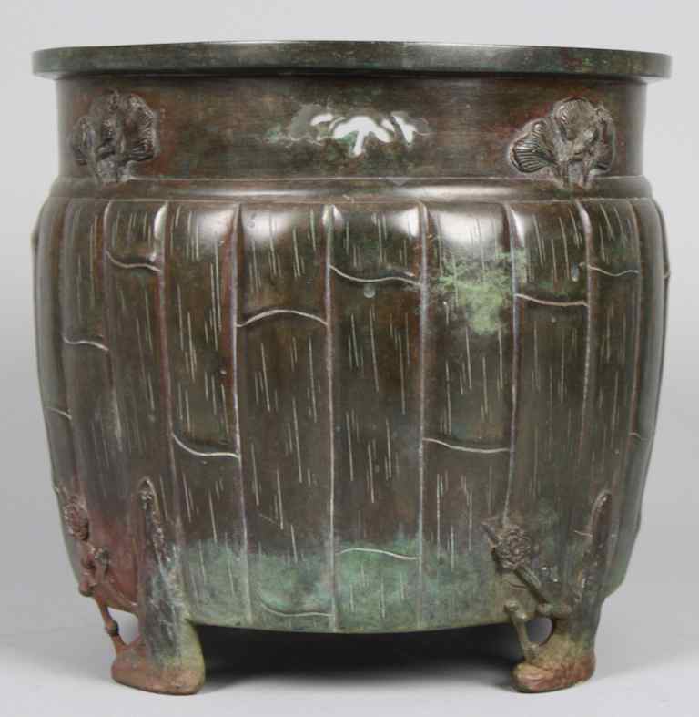 Appraisal: JAPANESE BRONZE BARREL-FORM JARDINI RE the slightly gobular central section