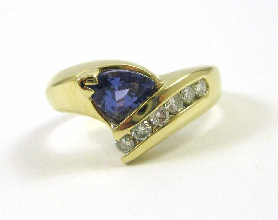 Appraisal: TANZANITE DIAMOND AND FOURTEEN KARAT GOLD RING set with six