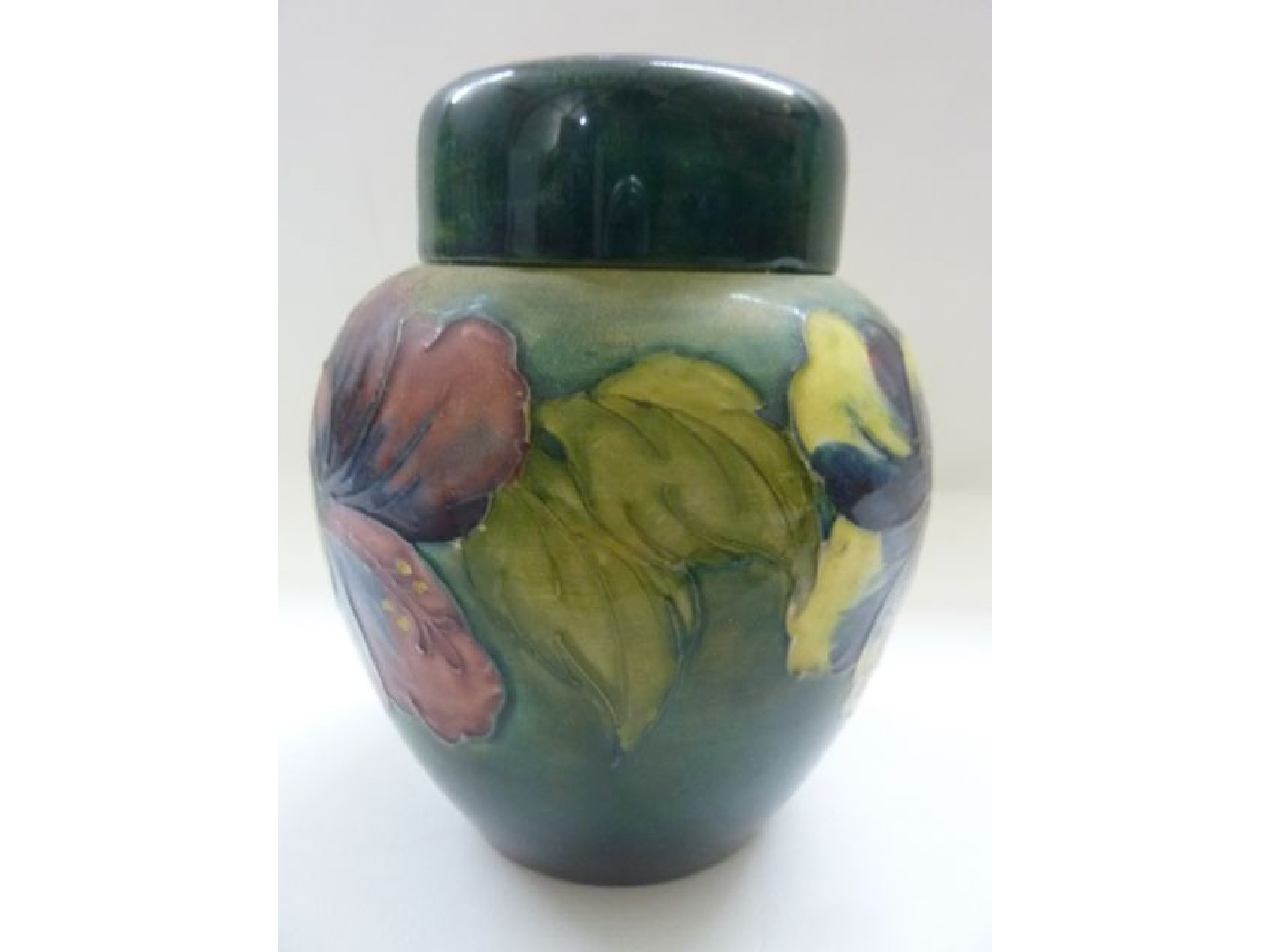 Appraisal: A Moorcroft oviform ginger jar and cover with trailing floral