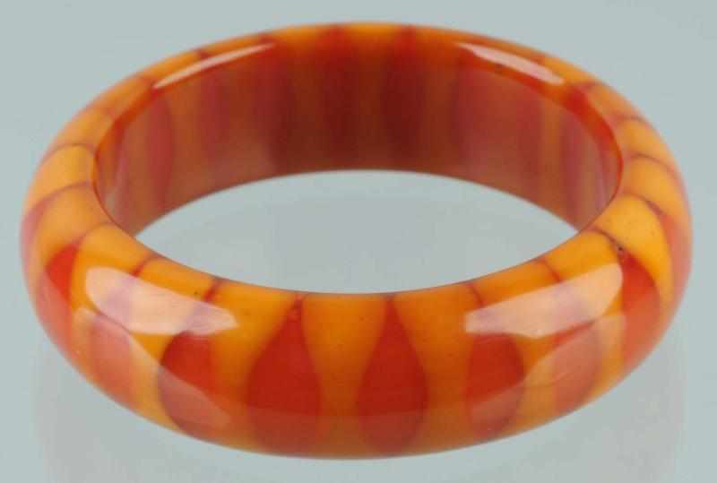 Appraisal: Vintage Bakelite Bow-Tie Bracelet Description Butterscotch and red bangle Condition