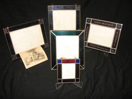 Appraisal: Five colored glass framed lithophane panels Depicting cityscapes landscapes and