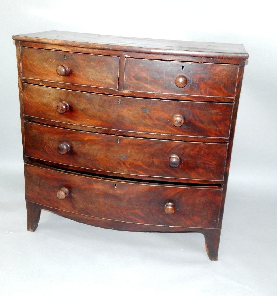 Appraisal: A George III mahogany bow front chest of drawers with