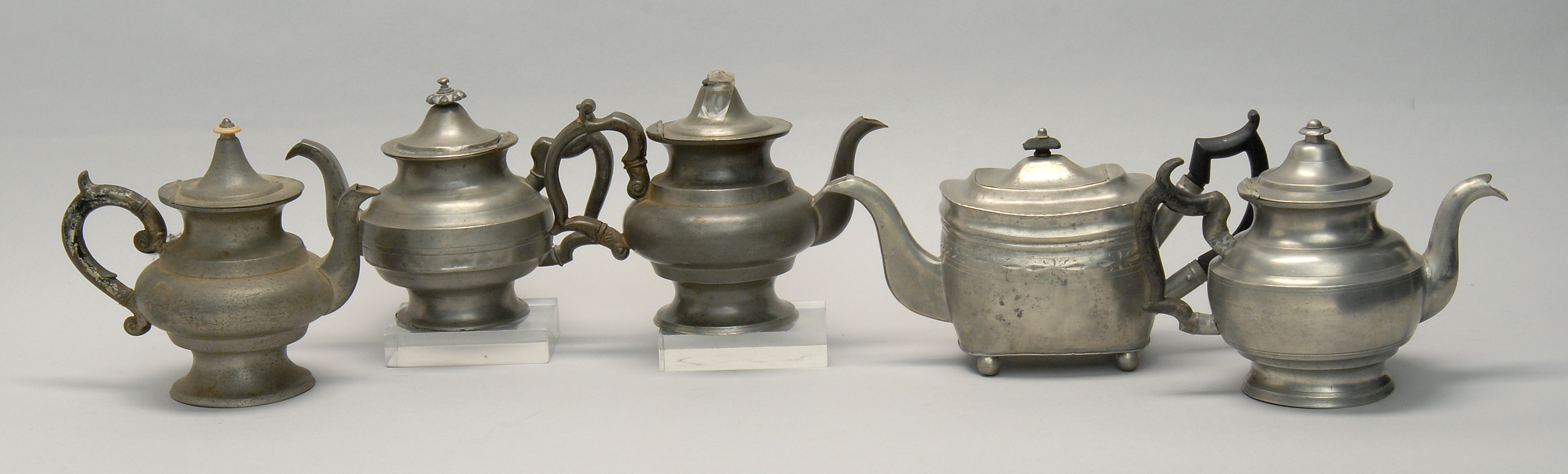 Appraisal: FIVE ANTIQUE AMERICAN PEWTER TEAPOTS one by Lemuel Curtis and