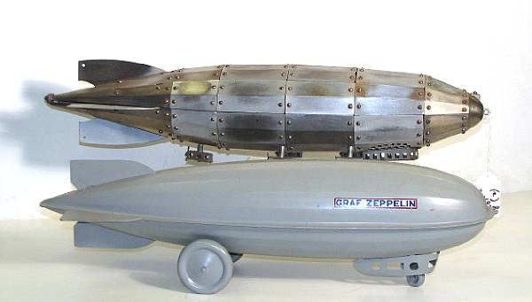 Appraisal: Pressed steel zeppelins Lot comprises a restored Steelcraft Zep 's