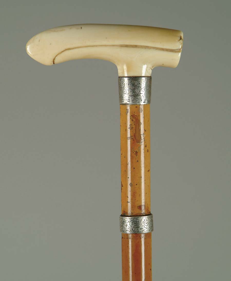 Appraisal: CANE CARVED IVORY CANE Ivory L T handle has sterling