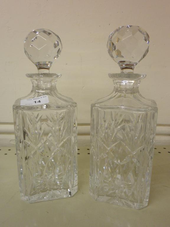 Appraisal: A pair of cut glass square section decanters and stoppers