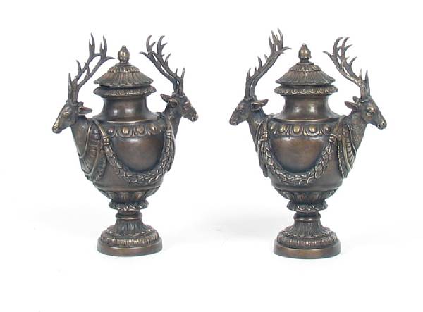 Appraisal: A pair of patinated bronze covered urns height in width