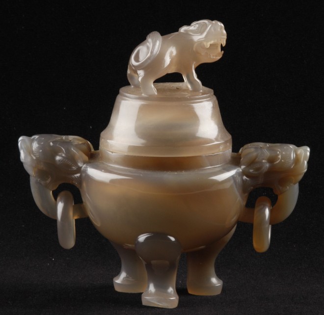 Appraisal: Censor features foo dog finial and two lion form handles