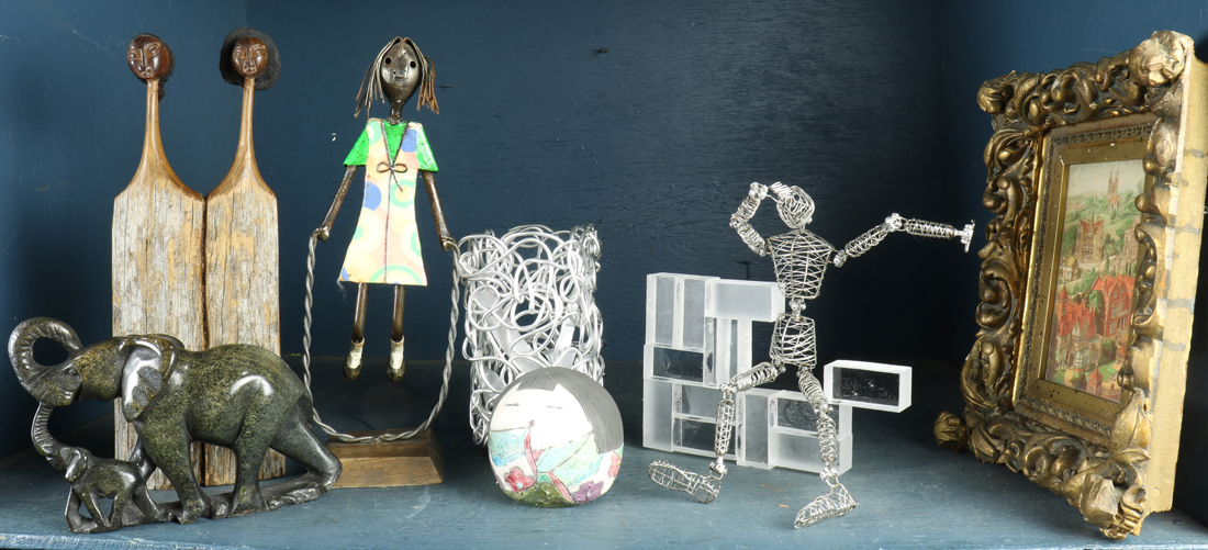 Appraisal: Shelf of modern wood or metal figures including a girl