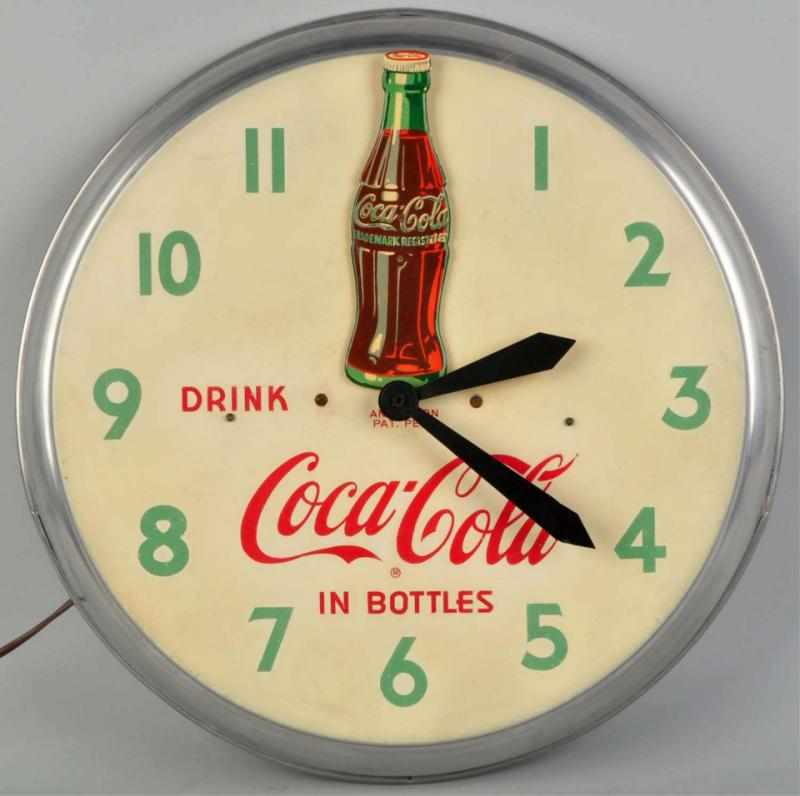 Appraisal: Coca-Cola Animated Electric Clock Circa The original bottle rocks back